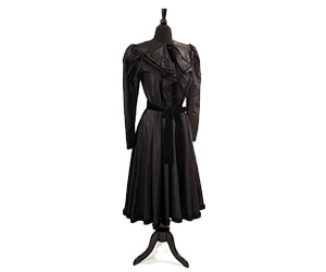 Givenchy dress in a black silk blend with velvet piping and a tied belt.